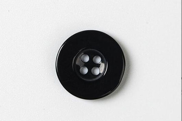 Plastic black button